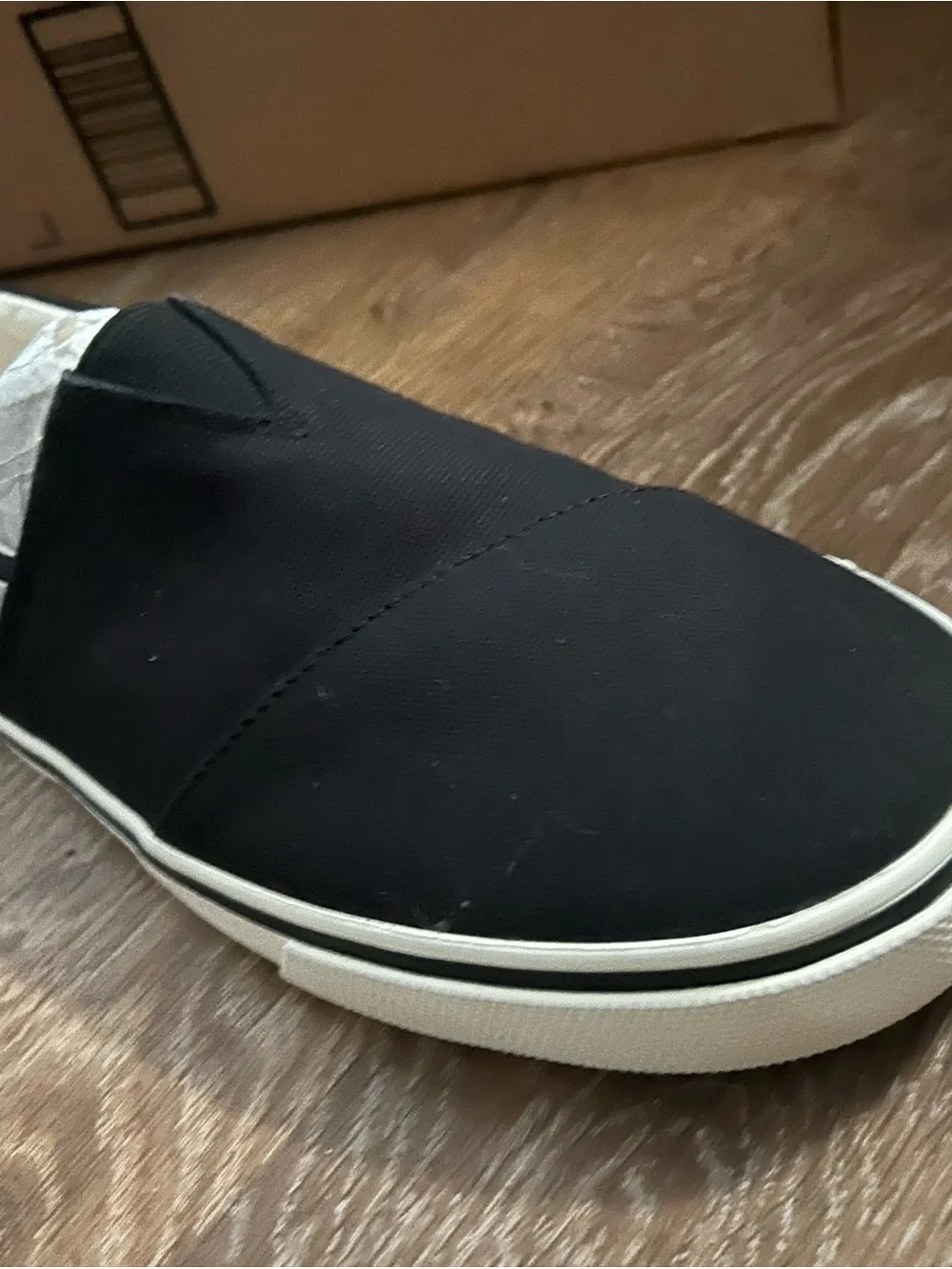 TOMS Black Canvas Slip-On Sneakers with White Trim